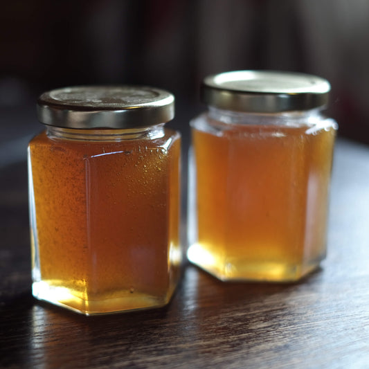 Two jars of freshly collected honey at Lynbreck Croft.